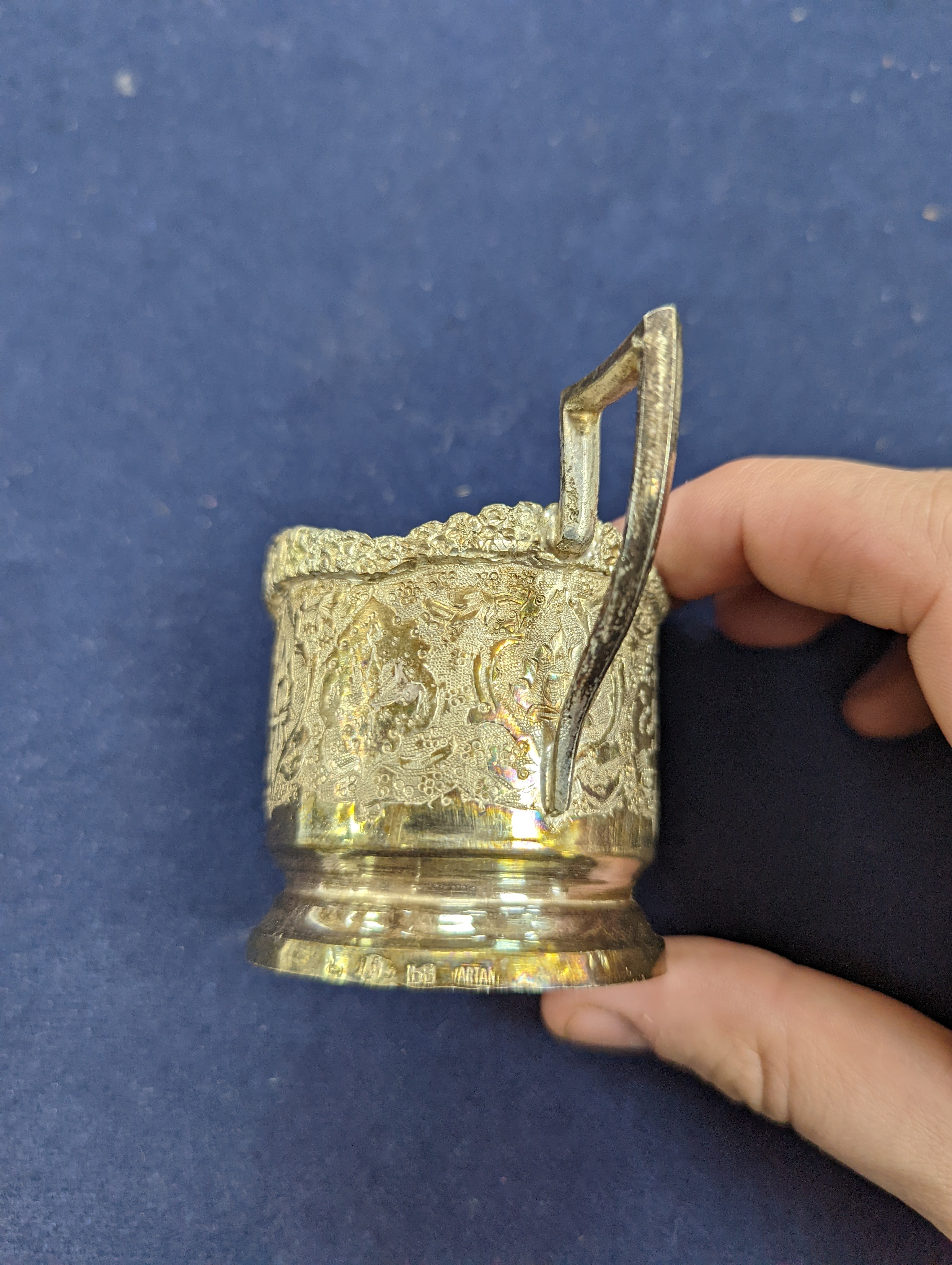 A set of six Persian embossed 84 standard white metal coffee cup holders and matching sugar bowl and cover by Vartan and four other Persian white metal items.